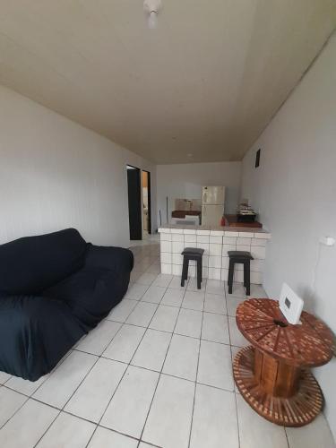 a living room with a couch and a table at Apartamentos GoZu # 2 in Puerto Viejo