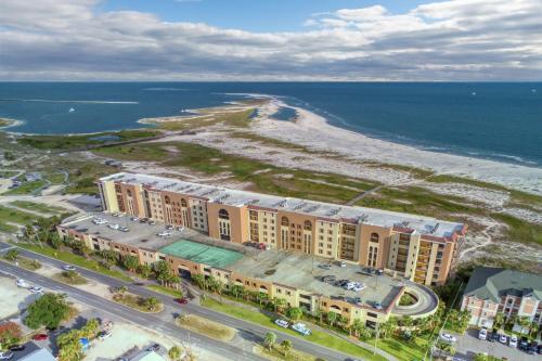 an aerial view of a building next to the ocean at Holiday Isle 603 in Dauphin Island