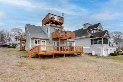 a large house with a large deck on it at Walk to Eastern Point Beach Apt with Water View! in Groton