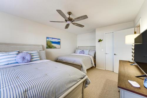 a bedroom with two beds and a ceiling fan at The Best Views on Beaver Lake! Home with Deck and BBQ in Rogers