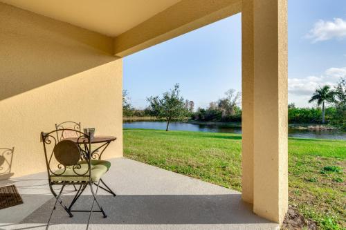 a patio with a table and a chair on a porch at 7 Mi to USTA Waterfront Tennis House with Yard! in Kissimmee