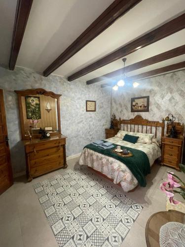 a bedroom with a bed and a sink in it at Casa rural los J esuses in Lillo