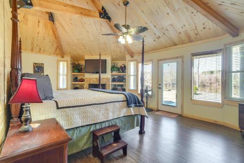 a bedroom with a bed and a wooden ceiling at Fire Pit, Views Lakefront Toledo Bend Retreat! in Many