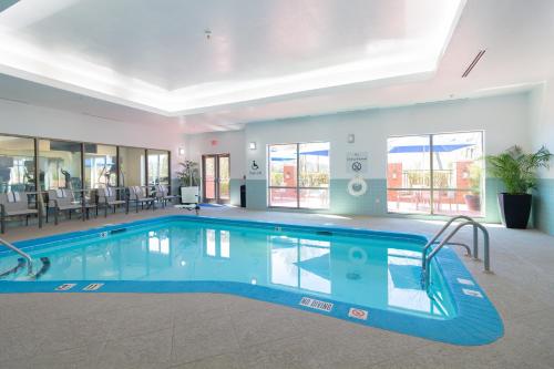 a large swimming pool in a hotel room at Holiday Inn Express Leland - Wilmington Area by IHG in Leland