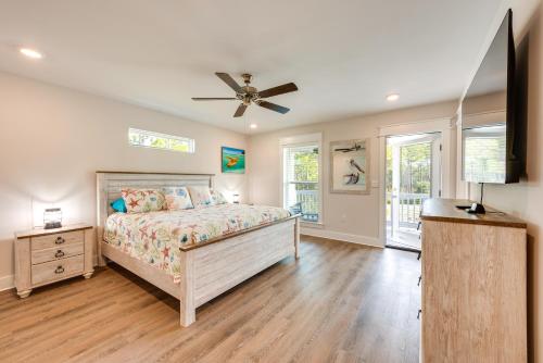 a bedroom with a bed and a ceiling fan at Family Beach Getaway in St Teresa Bike to Ocean! in Big Blackjack Landing