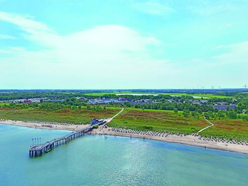 an aerial view of a bridge over a body of water at Appartements im Freizeitpark Weissenhäuser Strand in Weissenhäuser Strand