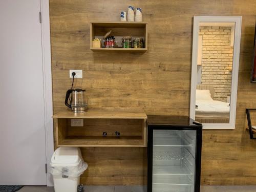 a room with a wooden wall with a counter and a toilet at 8kmלחרמון in Majdal Shams