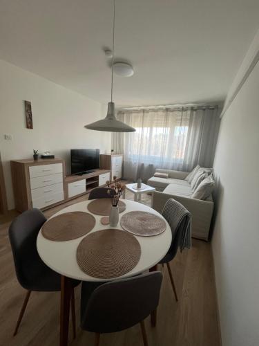 a living room with a table and a couch at Z&Z Apartman in Szeged