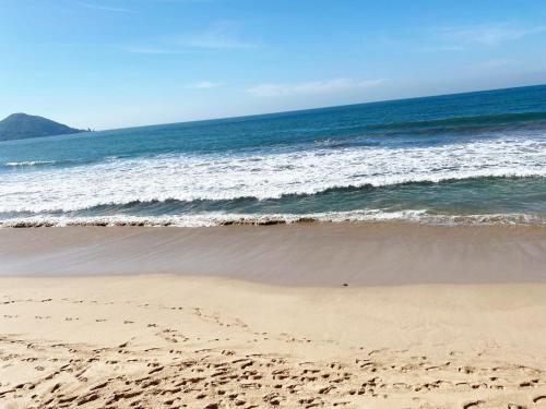 a sandy beach with the ocean in the background at Marina Cerritos Azul Turquesa #3 - 4 Albercas - 1 Min Playas in Mazatlán