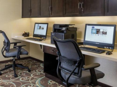 an office with two computers and a printer on a desk at Hampton Inn & Suites San Bernardino in San Bernardino