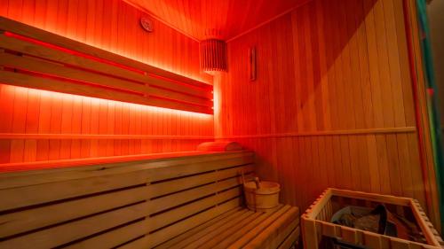 a small sauna with red lights in a room at Cine47spa in Précy-sur-Oise