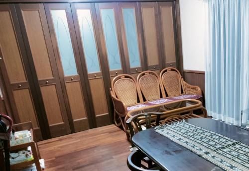 a room with three chairs and a table in a room at Kanupata - Vacation STAY 18614 in Ishigaki Island