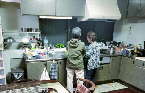 two women standing in a kitchen preparing food at Kanupata - Vacation STAY 18614 in Ishigaki Island