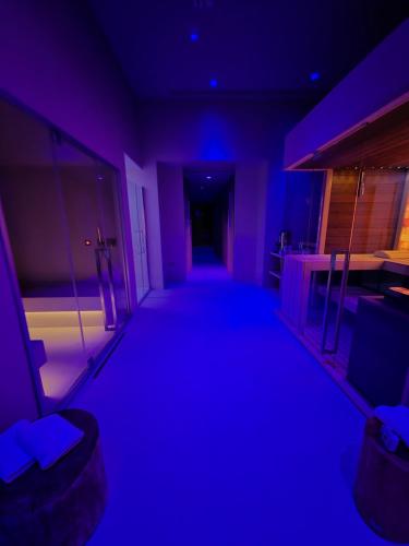 a dark room with blue lights in a building at Hotel Regina Margherita in Cagliari