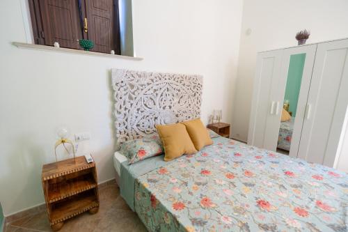 Ένα ή περισσότερα κρεβάτια σε δωμάτιο στο Paolino Home And Rooms