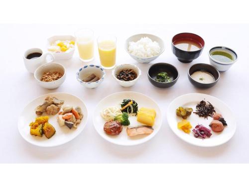 a group of plates of food on a table at Smile Hotel koriyama - Vacation STAY 61210v in Koriyama