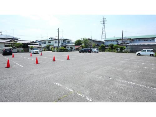 a parking lot with orange cones in a parking lot at Smile Hotel koriyama - Vacation STAY 61210v in Koriyama