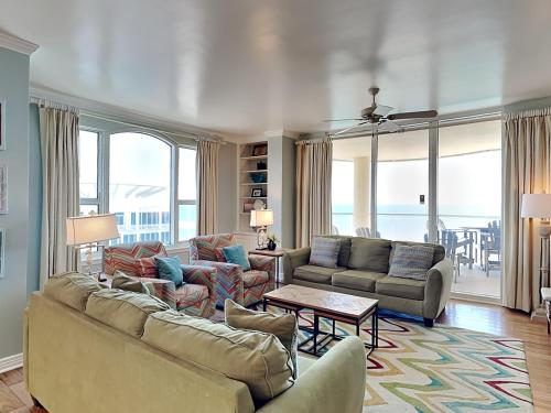 a living room with a couch and chairs and a table at Beach Colony East #15A in Perdido Key