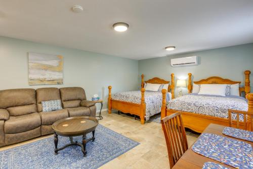 a living room with a couch and a bed and a couch at Near Steinhatchee River Studio with Screened Porch! in Steinhatchee