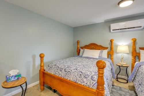 a bedroom with a wooden bed in a room at Near Steinhatchee River Studio with Screened Porch! in Steinhatchee