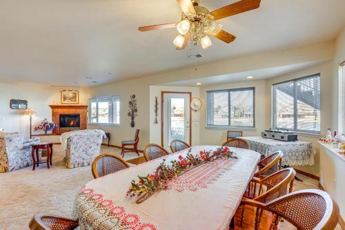 a dining room with a table with flowers on it at 7 Mi to Dtwn Denver Lakefront Gem with Dock! in Denver