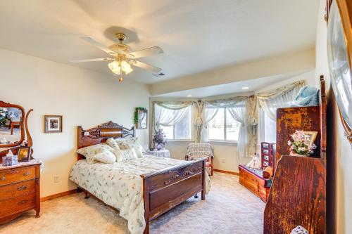 a bedroom with a bed and a ceiling fan at 7 Mi to Dtwn Denver Lakefront Gem with Dock! in Denver