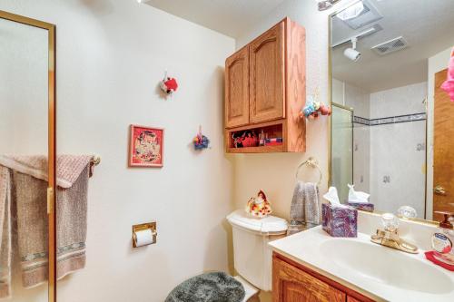 a bathroom with a toilet and a sink at 7 Mi to Dtwn Denver Lakefront Gem with Dock! in Denver