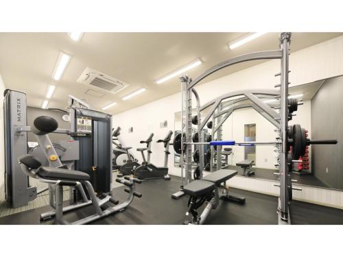 a gym with several treadmills and machines at Hotel Futaba no Mori - Vacation STAY 56187v in Kiyohashi