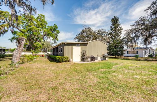 a house with a yard in front of it at 27 Mi to The Villages Lush Home with Outdoor Space! in Bushnell