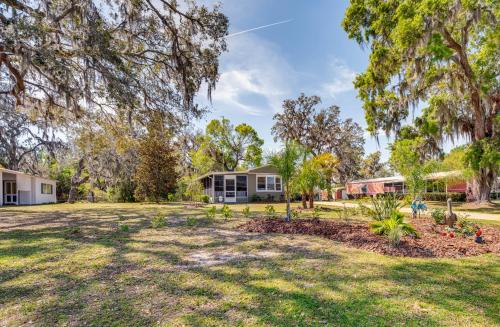 an open yard with a house in the background at 27 Mi to The Villages Lush Home with Outdoor Space! in Bushnell