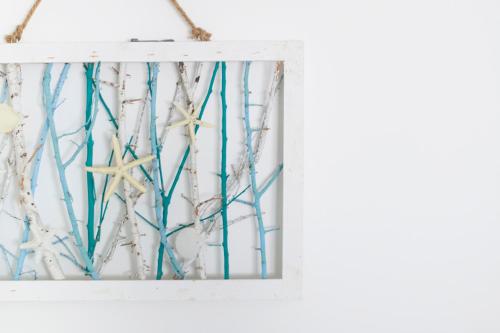 a framed picture of trees and starfish at Sul mare in centro con 2 camere e posto auto a novembre in Pescara