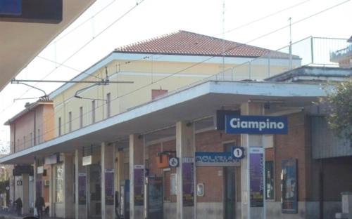 a building with a street sign in front of it at Ciampino Luxe -15min Termini, Airport and Train Station - in Ciampino
