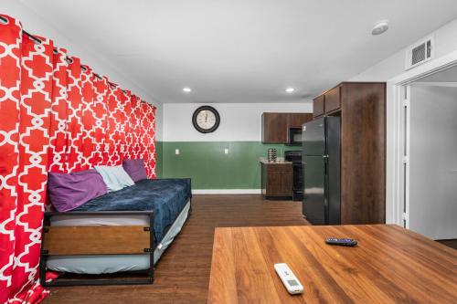 a bedroom with a bed and a table in a room at Modern Quirky Apartment Near Medical Center in Houston