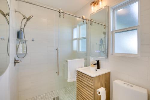 a bathroom with a shower and a toilet and a sink at 1 Mi to Balboa Park Apt with Furnished Patio! in San Diego