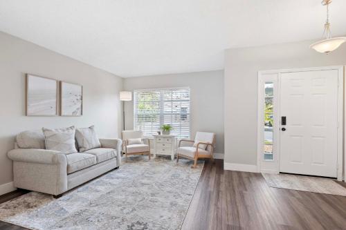 a living room with a couch and a table at Saltwater Pool and Spa at Home in Bradenton in Bradenton