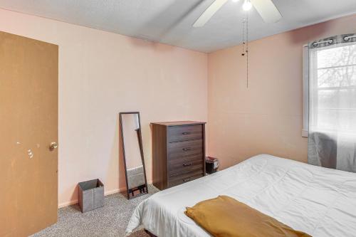 a bedroom with a bed and a dresser and a mirror at Pet-Friendly Little Rock Home on Spacious Lot in Little Rock