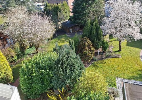 an aerial view of a garden with trees and bushes at Ferienwohnung Schöne Aussicht in Nordenham