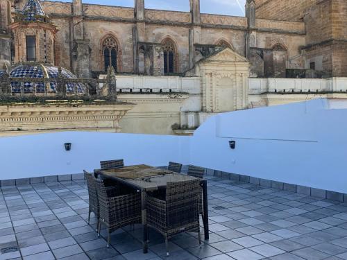 a table in front of a large building at Torre de Santa María in Utrera