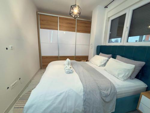 Postel nebo postele na pokoji v ubytování Ilidza Apartments - PEJTON RESIDENCE - Free Parking