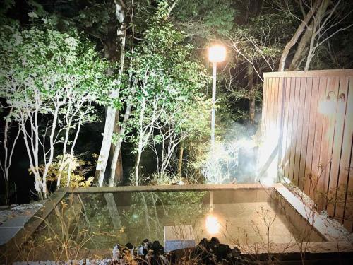 a street light in a park at night at Hakonesaryo Kintoki in Hakone
