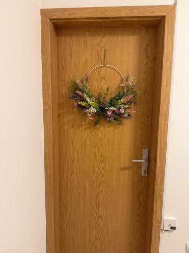 a wreath on the door of a room at Lorume in Postojna