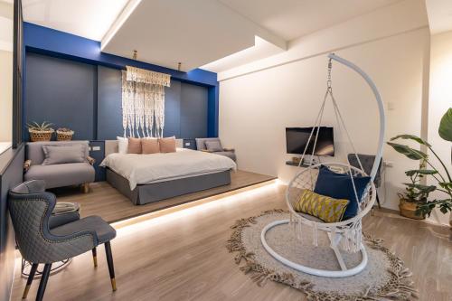 a bedroom with a bed and a swing at Beachcastle & Sea View Villa in Magong
