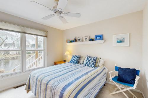 a bedroom with a bed and a window at Sea Colony - 55054 Pine Lake Dr in Bethany Beach