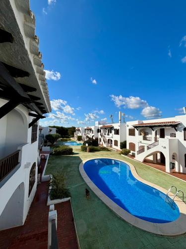 an external view of a house with a swimming pool at Els Vents OM IN WHITE, Refugio Zen en Son Parc, tranquilidad a 5 minutos de la playa in Son Parc