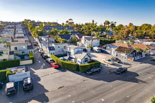 an aerial view of a city with cars parked in a parking lot at Barefoot 101 One Block to Beach 2 Bed 1 Bath in Encinitas
