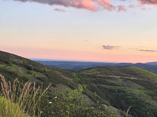 a view from the top of a hill at sunset at Portugals Infinity Eco Suite Resort in Tavira