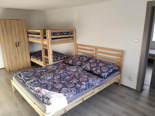 a bedroom with two bunk beds in a room at Chalupa Podolí u Bouzova in Bouzov