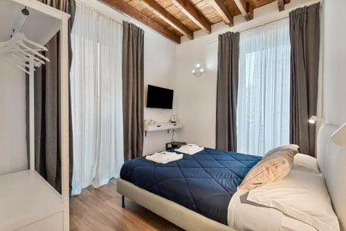 Una cama o camas en una habitación de Cinque Terre Memory Affittacamere