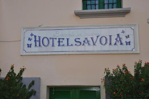 a sign on the side of a building at Hotel Savoia in Procida