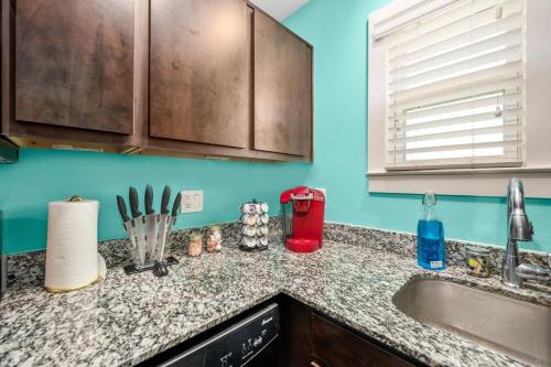 a kitchen with a sink and a counter top at Sleek 1BR Retreat Near NRG and Med Center in Houston